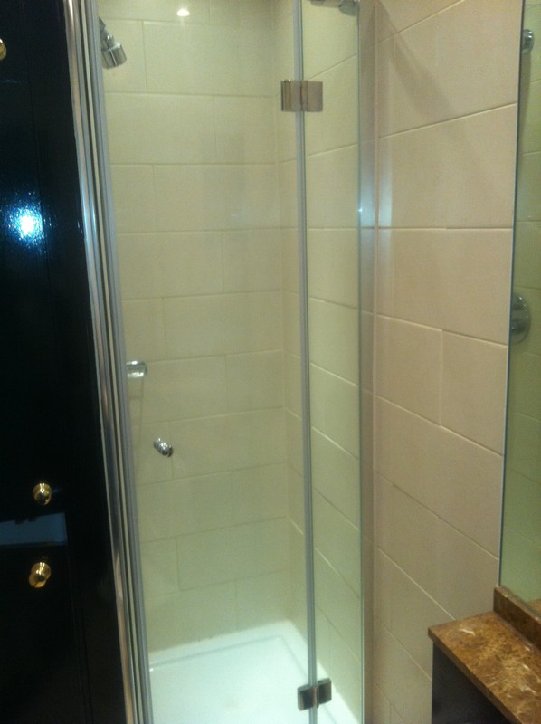 Frameless glass shower enclosure with chrome fittings in Mayfair